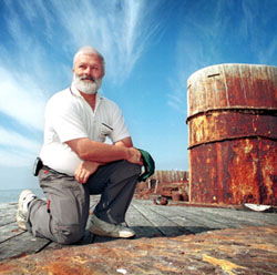 Friends of the Cerberus President John Toogood on board
HMVS Cerberus during the authorized Dec 2003 inspection.
Mr Toogood comtemplates the chances of saving
Australia's most important cultural heritage asset.
Photo courtesy of the Sunday Herald-Sun, Melbourne.